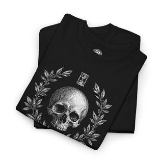 A folded black t-shirt with a detailed white graphic print of a skull, laurel wreath, and an hourglass on the front, displayed on a clean white background.