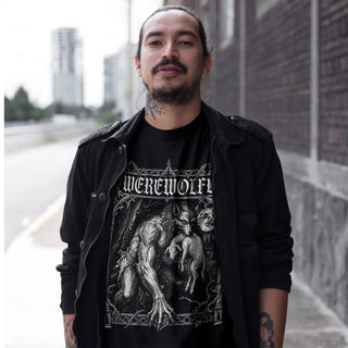 Man wearing a black t-shirt with 'Werewolf' design outdoors.