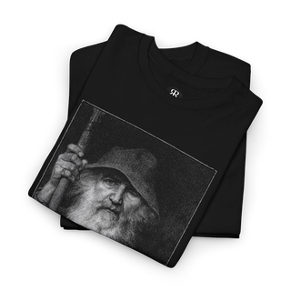 Black T-shirt featuring a monochrome graphic of Odin, the All-Father from Norse mythology, with a staff, and Elder Futhark script below.