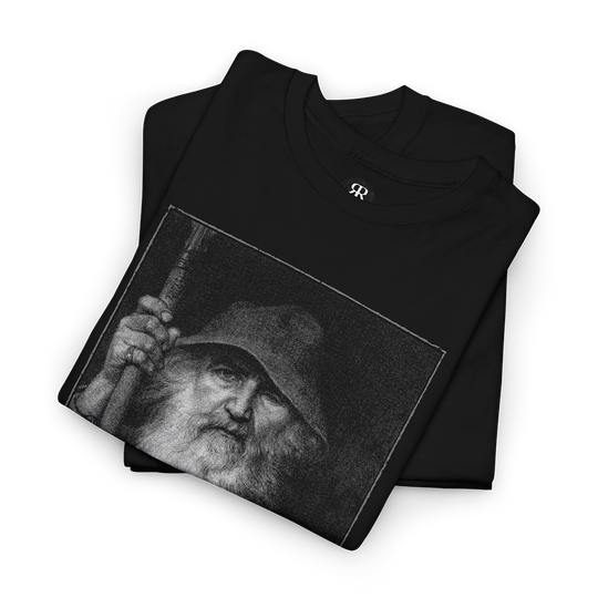 Black T-shirt featuring a monochrome graphic of Odin, the All-Father from Norse mythology, with a staff, and Elder Futhark script below.