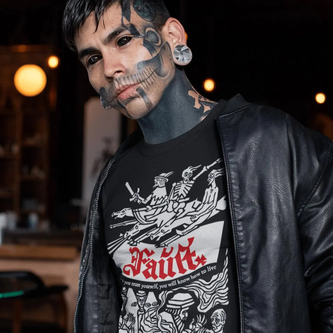 Tattooed man wearing Faust T-Shirt