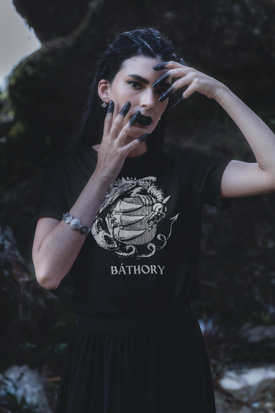 Woman wearing shirt showing Bathory Coat of Arms