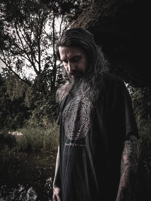 Man wearing Sigillum Dei Aemeth T-Shirt