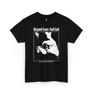 Black t-shirt with a print of a woman with human skull in her lap and text 'Beyond Love And Evil lies a sensual landscape'