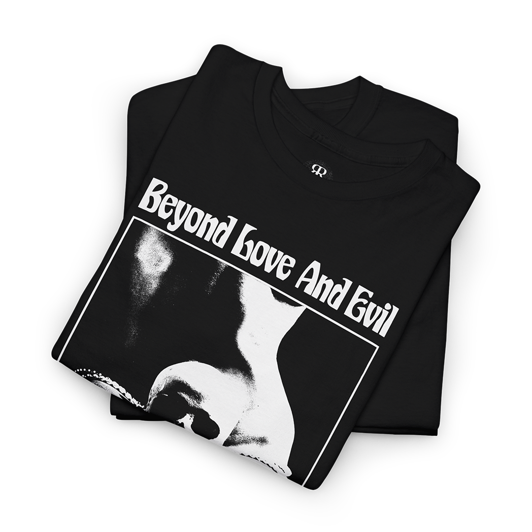 Black t-shirt with a print of a woman with human skull in her lap and text 'Beyond Love And Evil lies a sensual landscape'