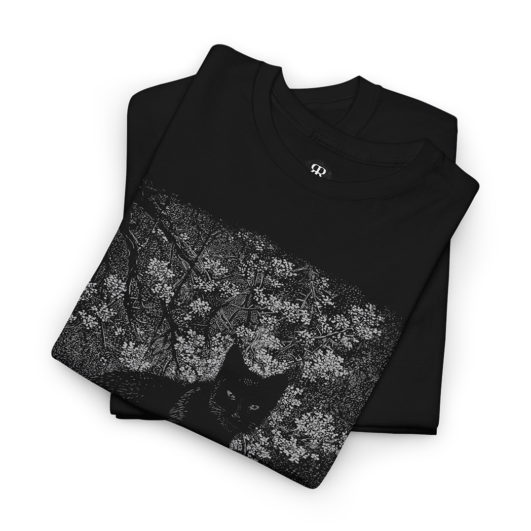 A black crew neck t-shirt with a graphic print of a black cat surrounded by floral elements on the front.