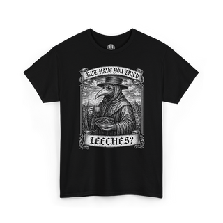A black short-sleeve crewneck t-shirt featuring a detailed black and white graphic print of a plague doctor holding a glass, with banners reading 'HAVE YOU TRIED LEECHES?'.