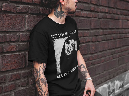 Tattooed man wearing Death in June shrt