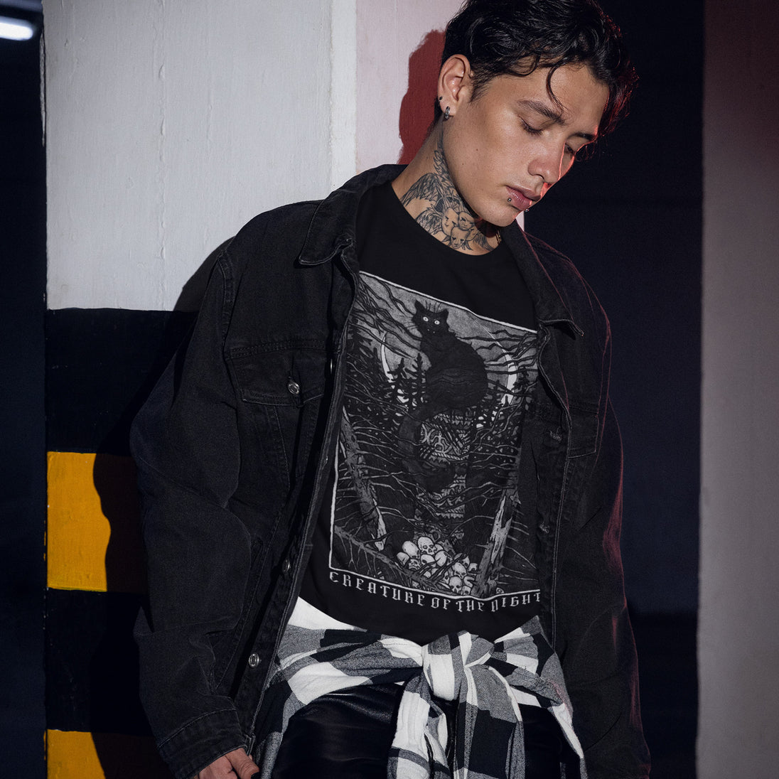 Tattooed man wearing Creature of the Night T-Shirt