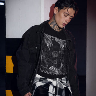 Tattooed man wearing Creature of the Night T-Shirt