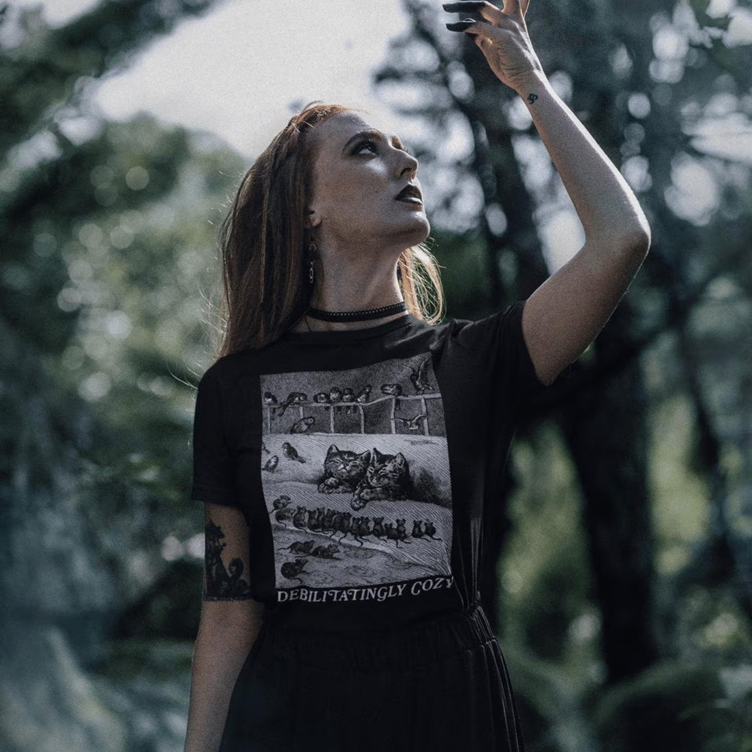 Woman wearing Debilitatingly Cozy Cats T-Shirt