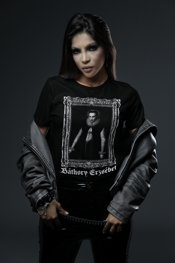 Woman wearing shirt showing framed portrait of Elisabeth Bathory