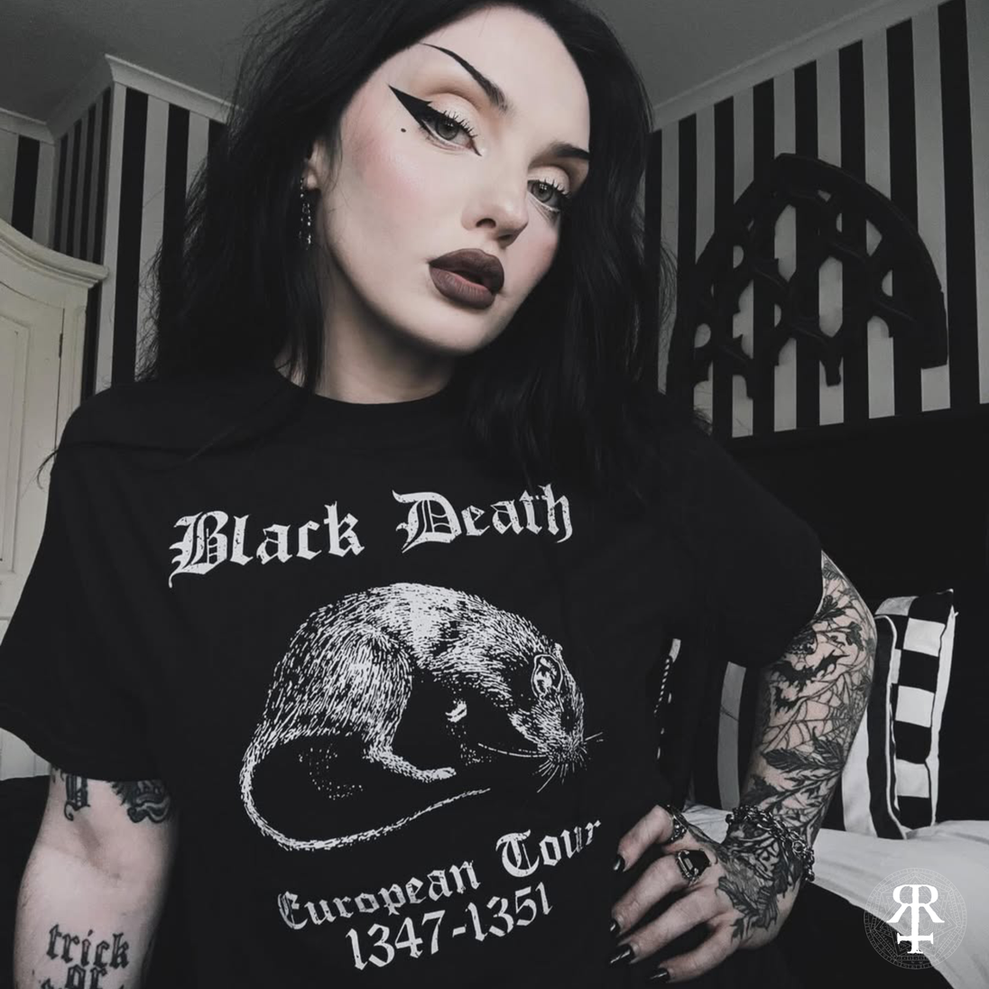 Woman wearing a black t-shirt with 'Black Death' graphic and text.