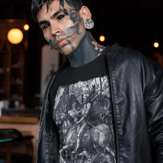 Tattooed man wearing Albrecht Dürer Knight Death and the Devil T-Shirt