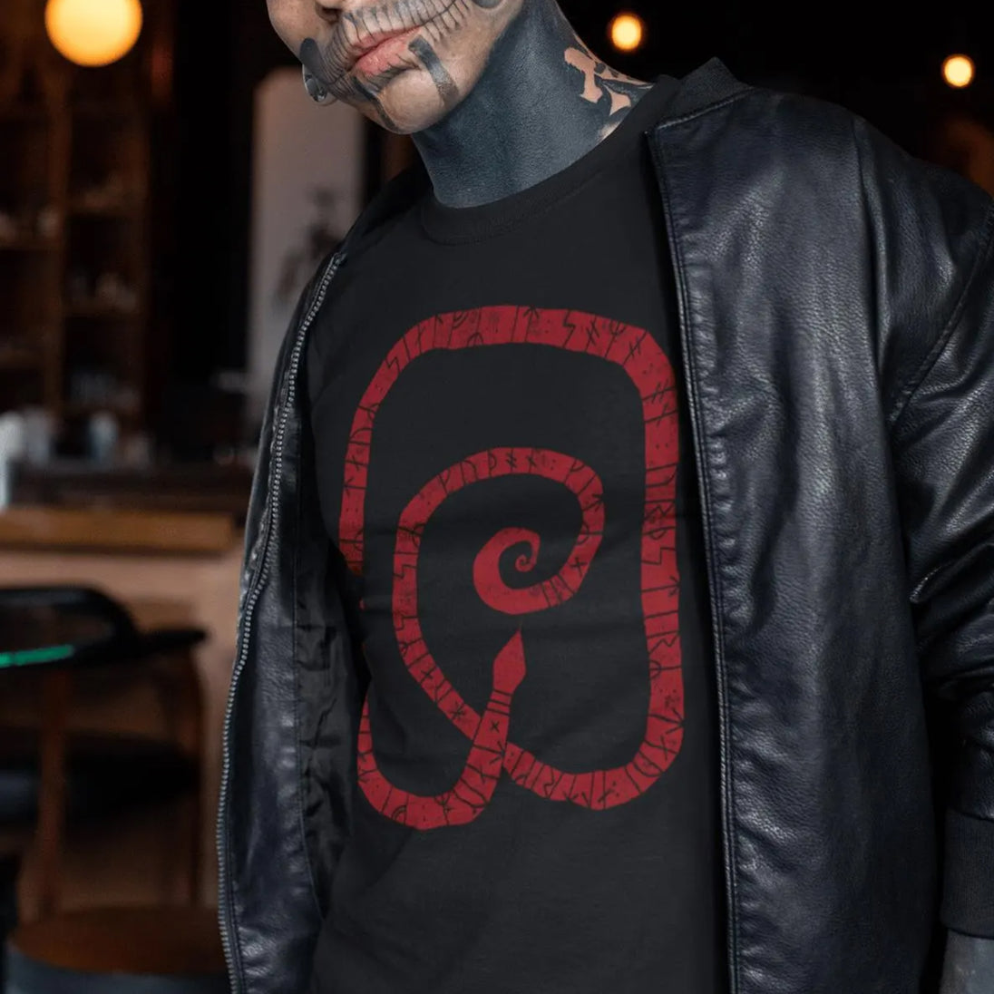 Tattoed man wearing black Gripsholm Stone T-Shirt