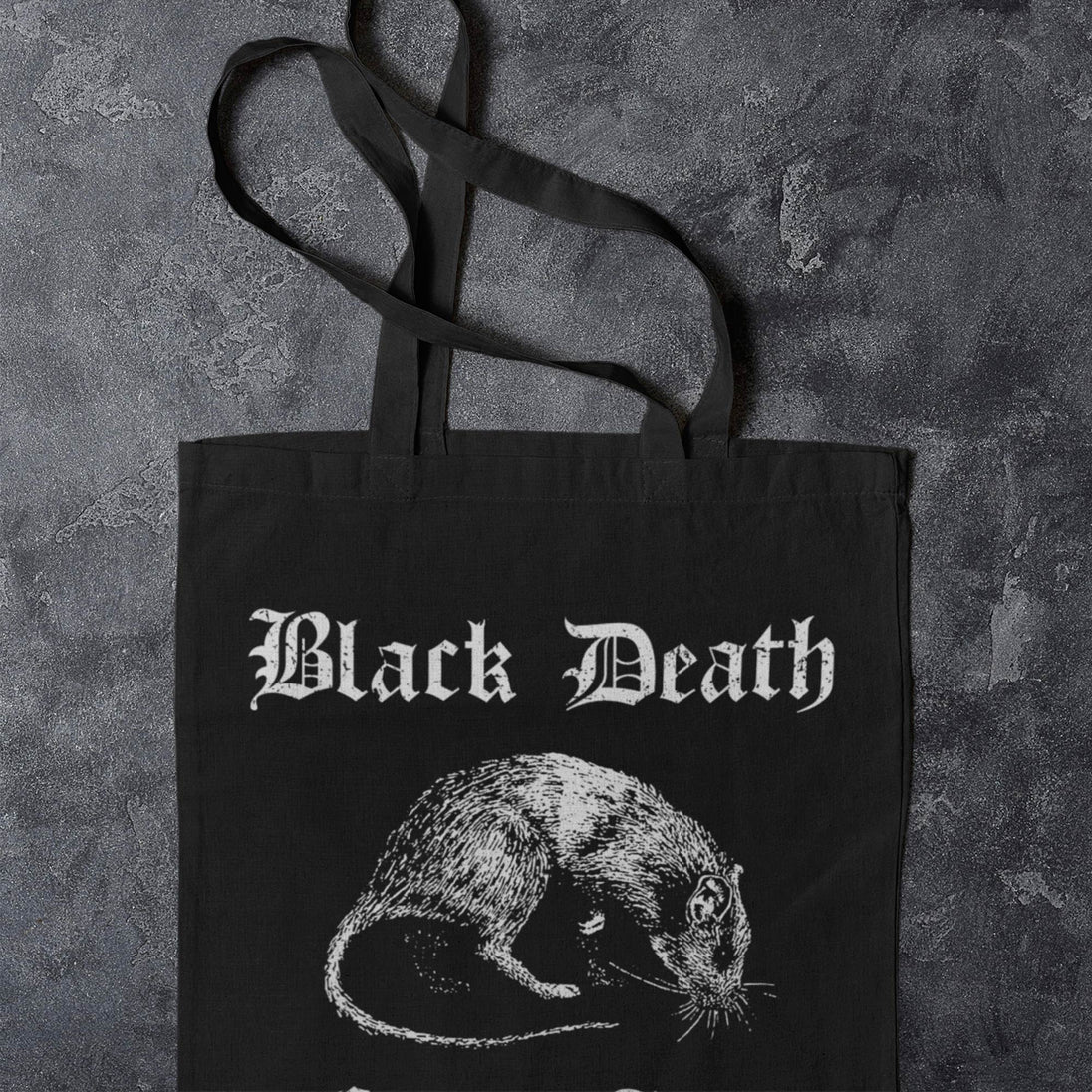 Black tote bag with 'Black Death' text and rat illustration on a textured gray background