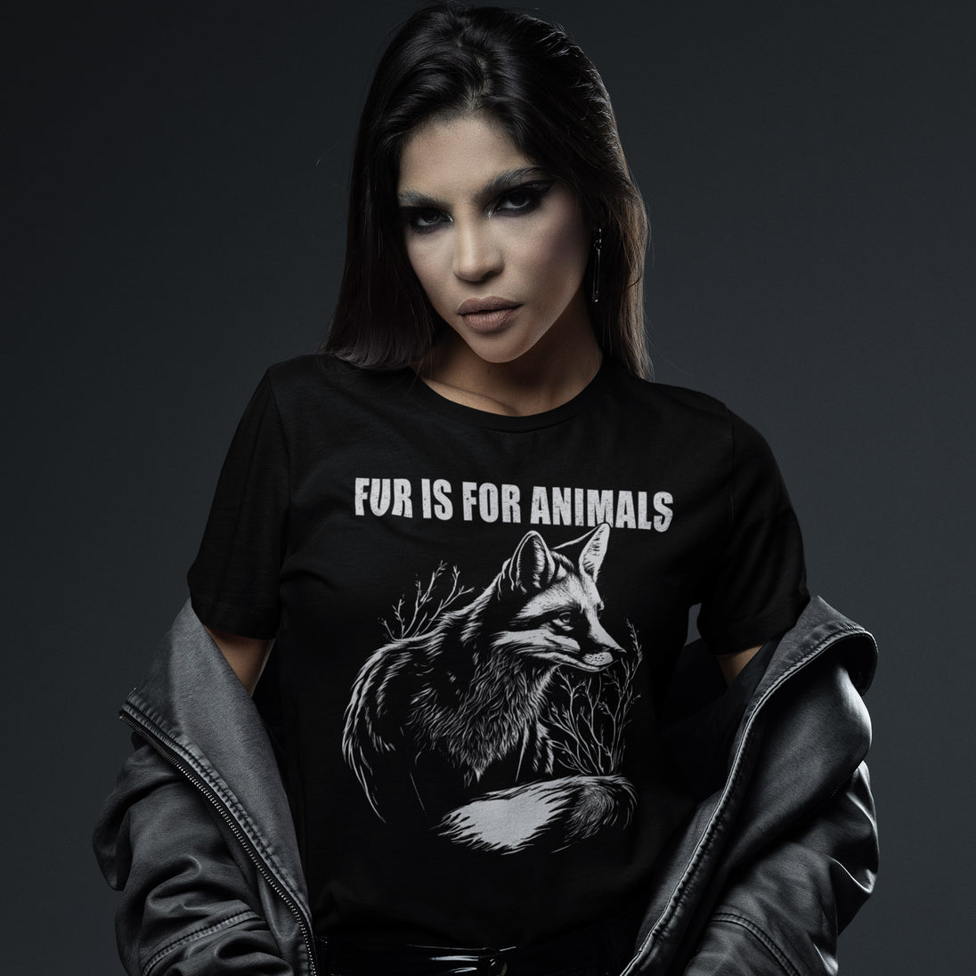 Person wearing a black t-shirt with a fox graphic and 'Fur is for Animals' text on a dark background