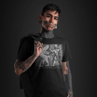 Tattoed man wearing Chaos Monster and Sun God T-Shirt
