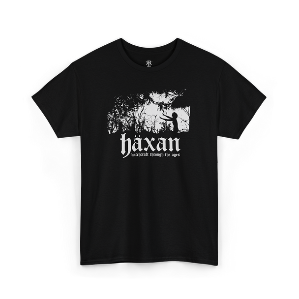 Black t-shirt with a white silhouette of a tree and a person on the front, and the text 'HäXAN WITCHCRAFT THROUGH THE AGES' below it.