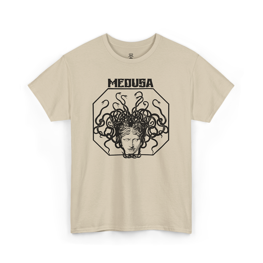 A beige T-shirt with a graphic print of the head of Medusa in the center, featuring red hair and a stylized design.