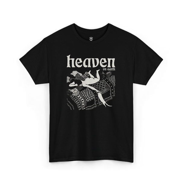 Black T-shirt with a graphic print of a woman playing with a cat in bed with 'HEAVEN ON EARTH' text above it.