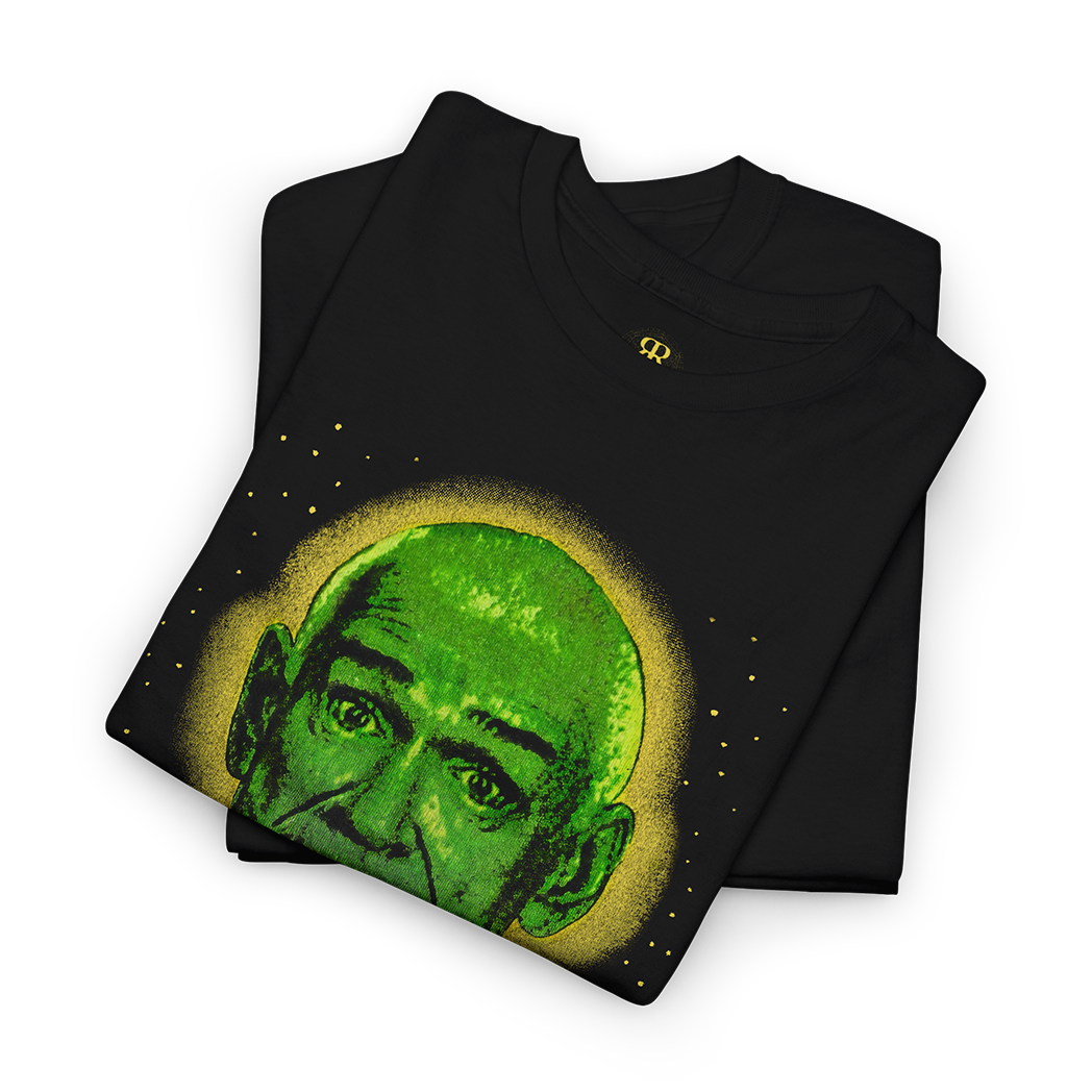 Black t-shirt with a green graphic and 'Follow Me' text on a white background