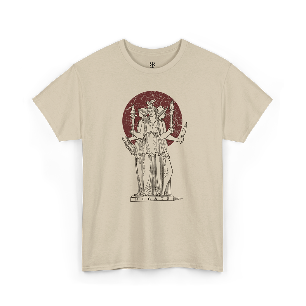 A sand T-shirt featuring a white illustration of Hecate, a figure from ancient Greek mythology, holding torches and keys.