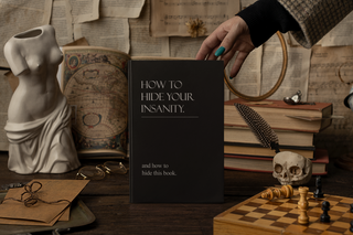 How to Hide Your Insanity' hardcover journal, matte finish, 150 lined pages, perforated, 5.75" x 8", casewrap binding