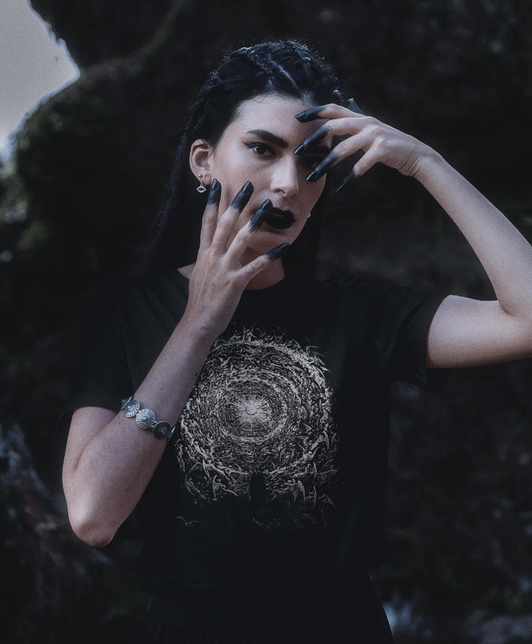 Woman wearing black t-shirt with grey The Empyrean design by Gustave Dore.