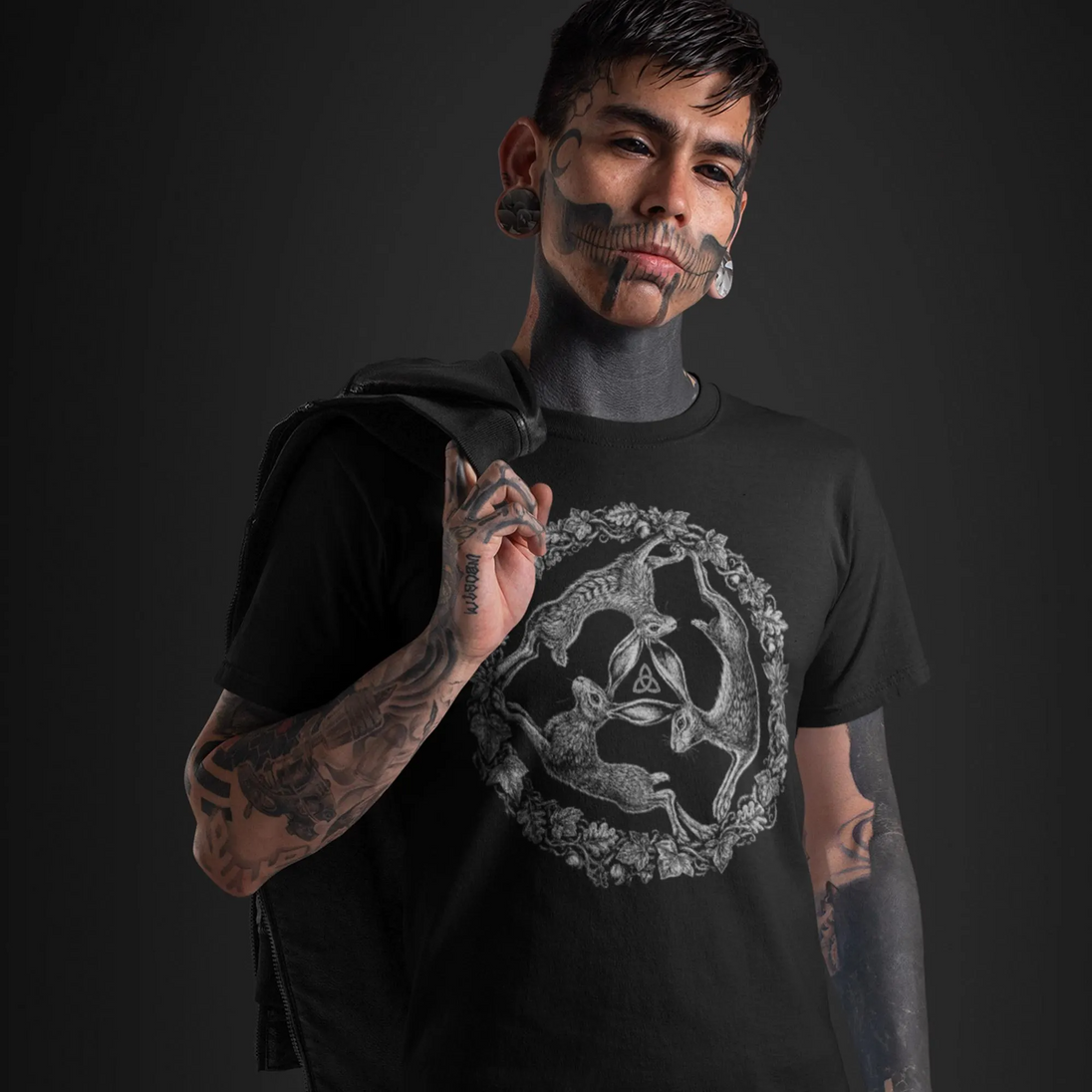 Tattooed man wearing Three Hares T-Shirt