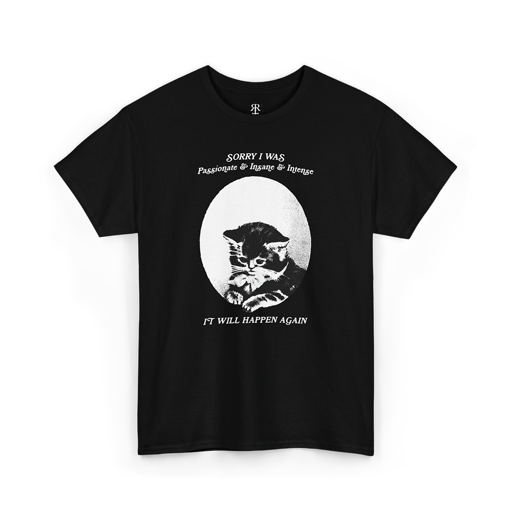 A black T-shirt with a graphic of a cat's face in the center and the text 'Sorry, I was just being my purrfectly passionate, intense, and slightly insane self