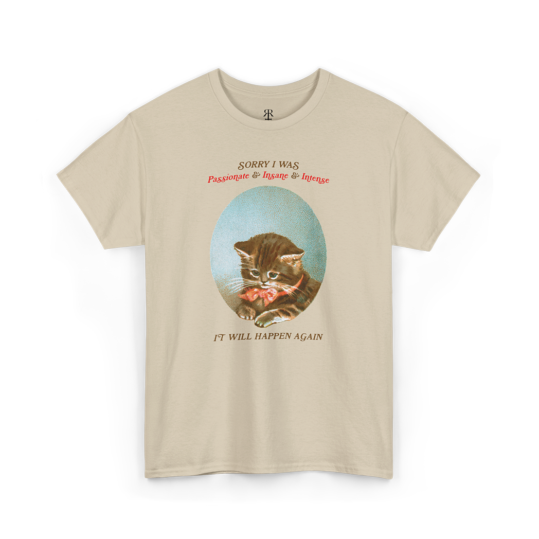 A sand T-shirt with a graphic of a cat's face in the center and the text 'Sorry, I was just being my purrfectly passionate, intense, and slightly insane self