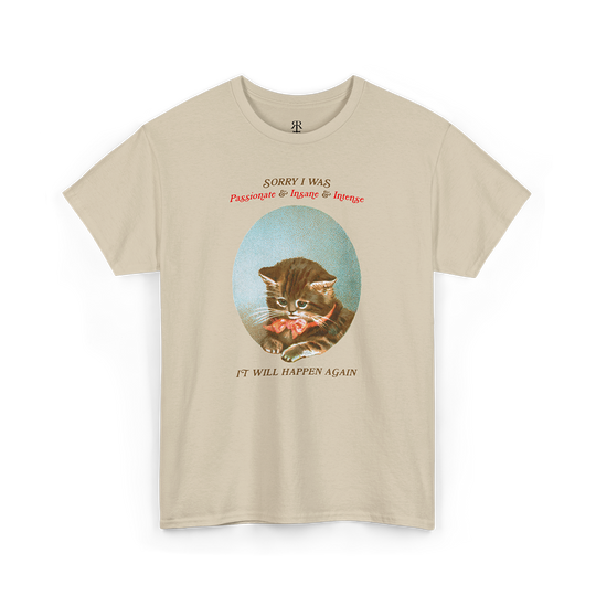 A sand T-shirt with a graphic of a cat's face in the center and the text 'Sorry, I was just being my purrfectly passionate, intense, and slightly insane self