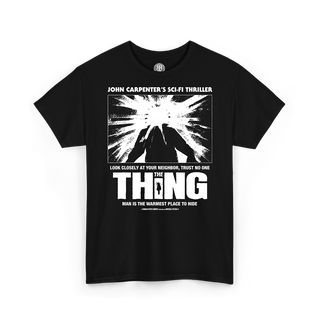 A black short-sleeve crewneck t-shirt featuring a white graphic print of the iconic 'The Thing' sci-fi thriller poster on the front, with text referencing the film.