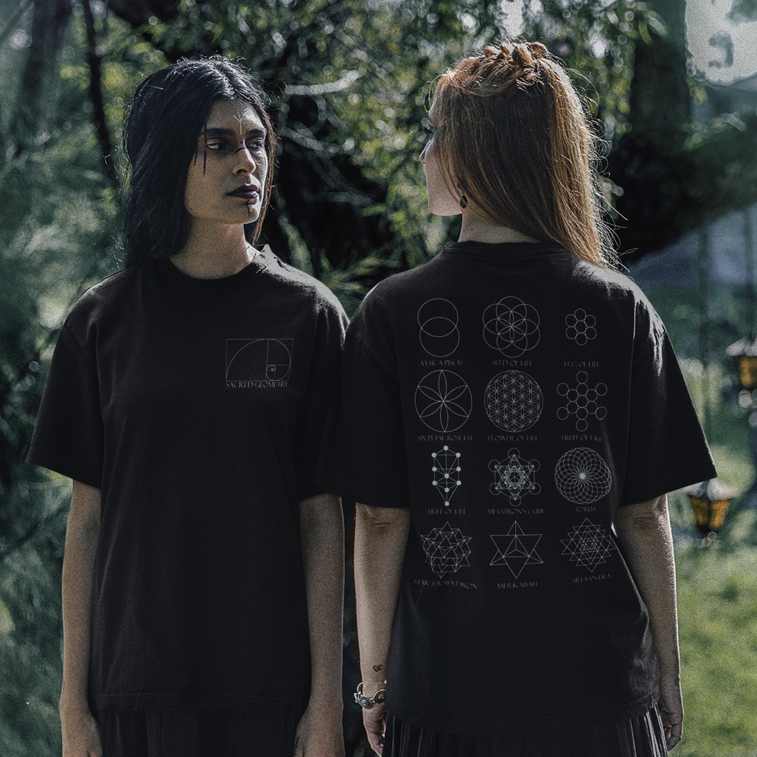Two women wearing Sacred Geometry T-Shirt in forest setting