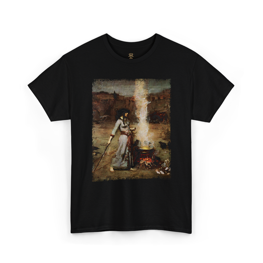 A black T-shirt featuring a printed image of a witchcraft scene with a woman, a cauldron, and a staff.