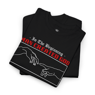 Black crew neck t-shirt with text 'In The Beginning MAN CREATED GOD' and a graphic of two hands reaching towards each other.
