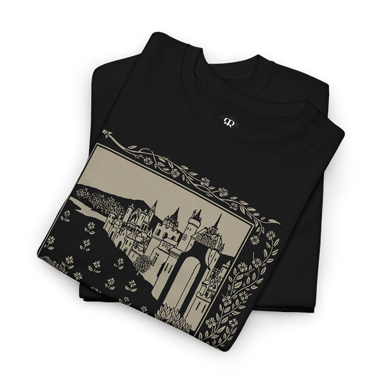 A black t-shirt featuring a printed design with a medieval castle and surrounding landscape.