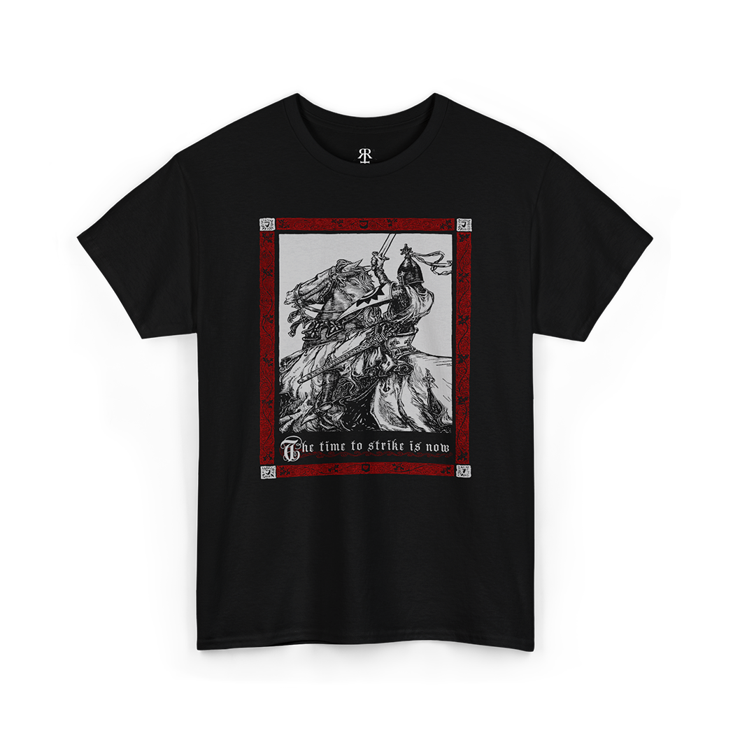 A black t-shirt with a medieval knight design, featuring a depiction of a knight on horseback with a red and gray background and the text 'THE TIME TO STRIKE IS NOW'.