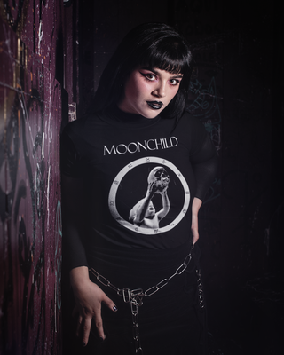 Woman wearing black Moonchild shirt