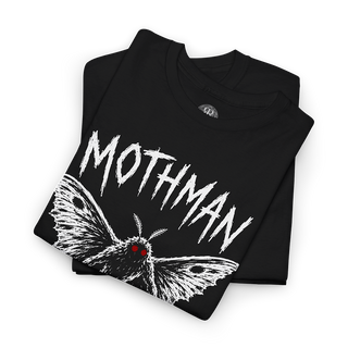 A folded black t-shirt featuring a white distressed graphic of a moth with red eyes and the word 'MOTHMAN' in a jagged white font, shown on a plain white background.