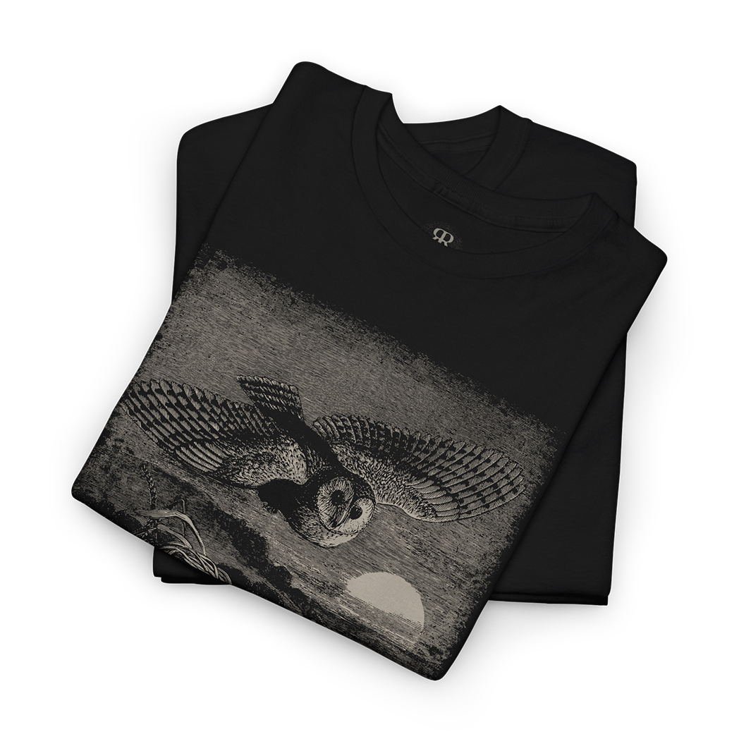 Black t-shirt with a graphic design of an owl  flying over a field