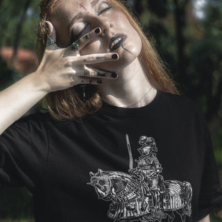 Woman in forest setting wearing black Born to Siege T-Shirt