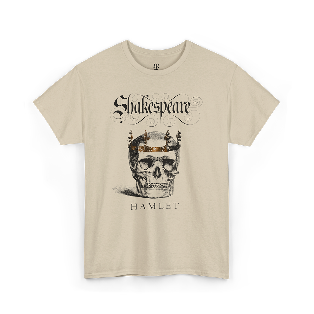A beige t-shirt with a graphic print of a skull wearing a crown, surrounded by text 'Shakespeare' and 'HAMLET'.