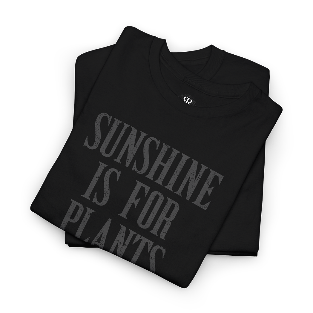 Black crew neck t-shirt with the text 'SUNSHINE IS FOR PLANTS' printed in gray on the front.