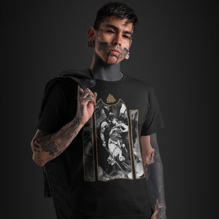 Tattoed man wearing Wotan's Farewell to Brunhild T-Shirt against dark background