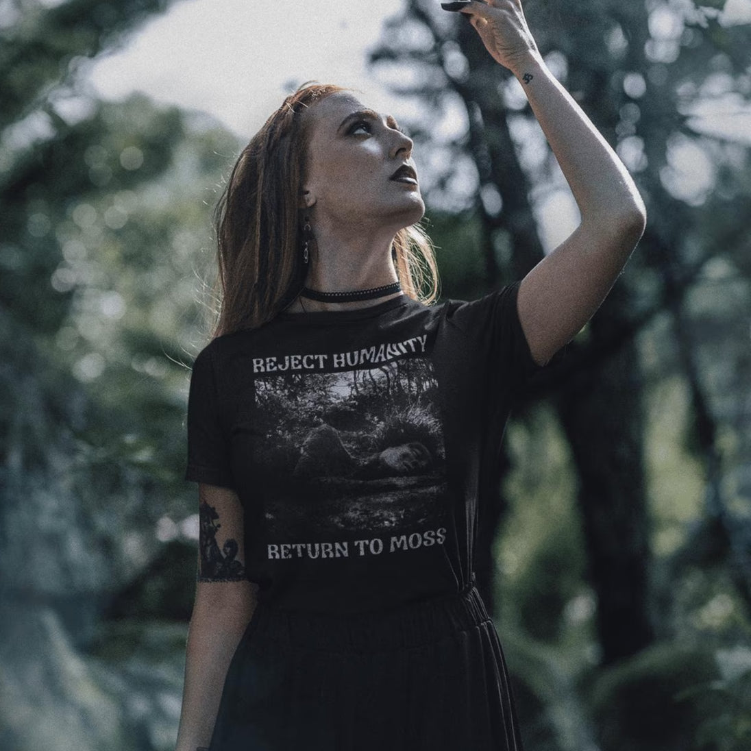 Woman wearing Reject Humanity Return to Moss t-shirt