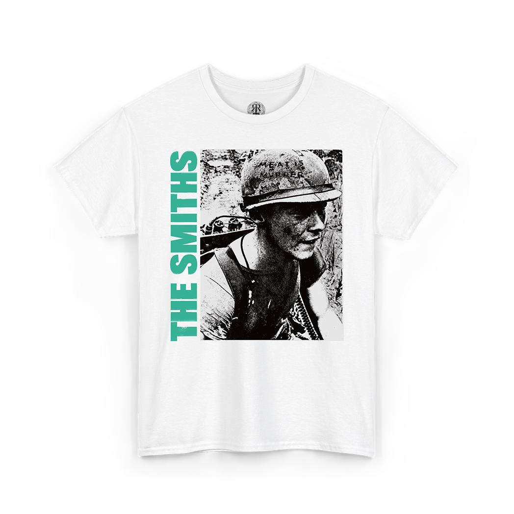 A white short-sleeve crewneck t-shirt featuring a graphic print of a black-and-white portrait of a soldier wearing a helmet, with the text 'THE SMITHS' printed vertically in bright green on the left side of the graphic.
