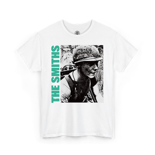 A white short-sleeve crewneck t-shirt featuring a graphic print of a black-and-white portrait of a soldier wearing a helmet, with the text 'THE SMITHS' printed vertically in bright green on the left side of the graphic.