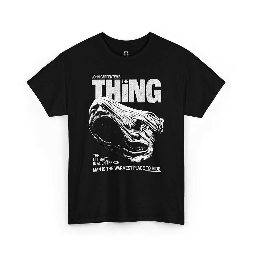 Black t-shirt with 'The Thing' graphic and text 'Man is the Warmest Place to Hide'.